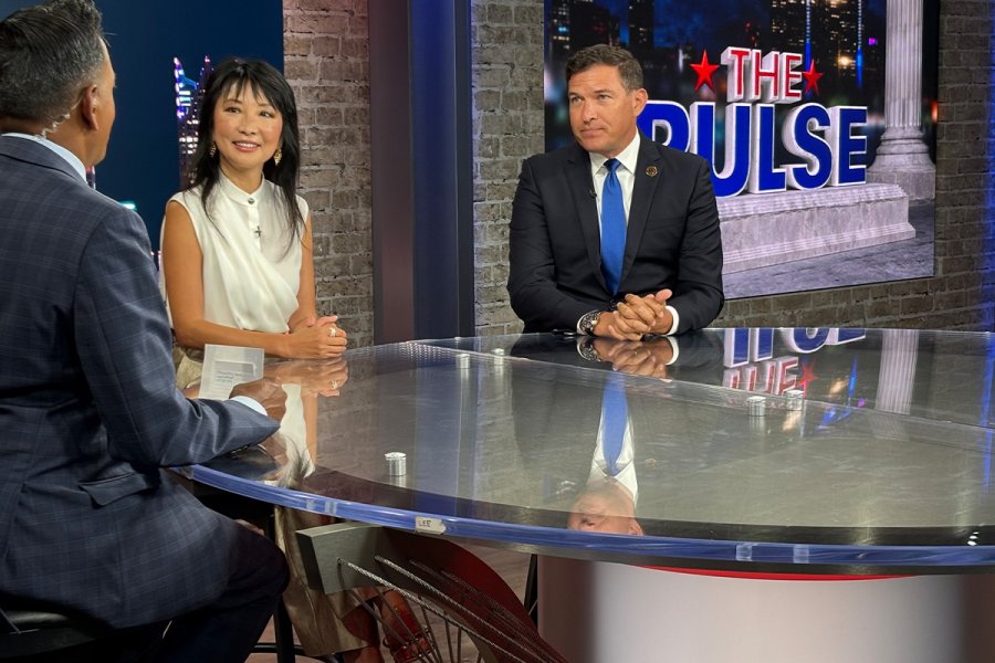 WMU President Russ Kavalhuna and Trustee Lynn Chen-Zhang sit at the news desk during an interview with a Fox 2 host.