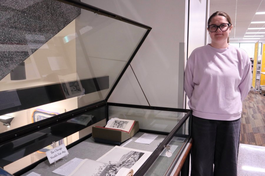 Western Michigan University student Autumn Ropp working on exhibit case about the Chicago World's Fair in 1893.