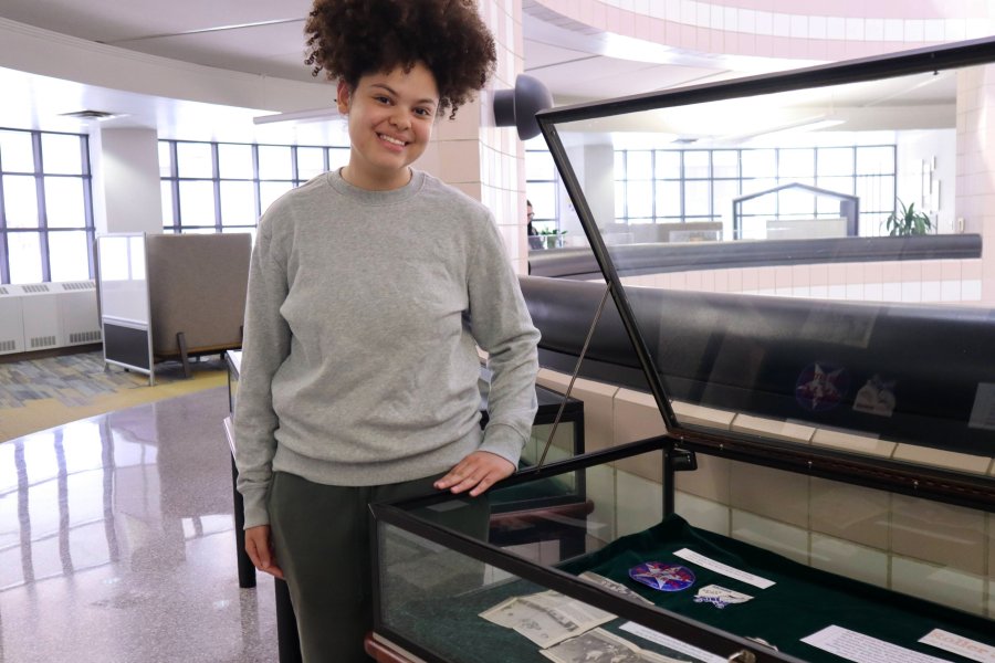 Western Michigan University student Whitney Griffin working on exhibit case about Roller Skating in the Kalamazoo Area..