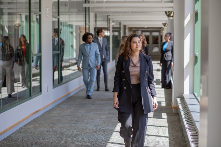 A student walks down the hallway at the Haworth College of Business