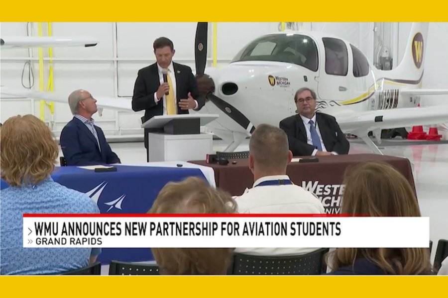 President Kavalhuna speaking at WMAA during a news conference in the hangar.