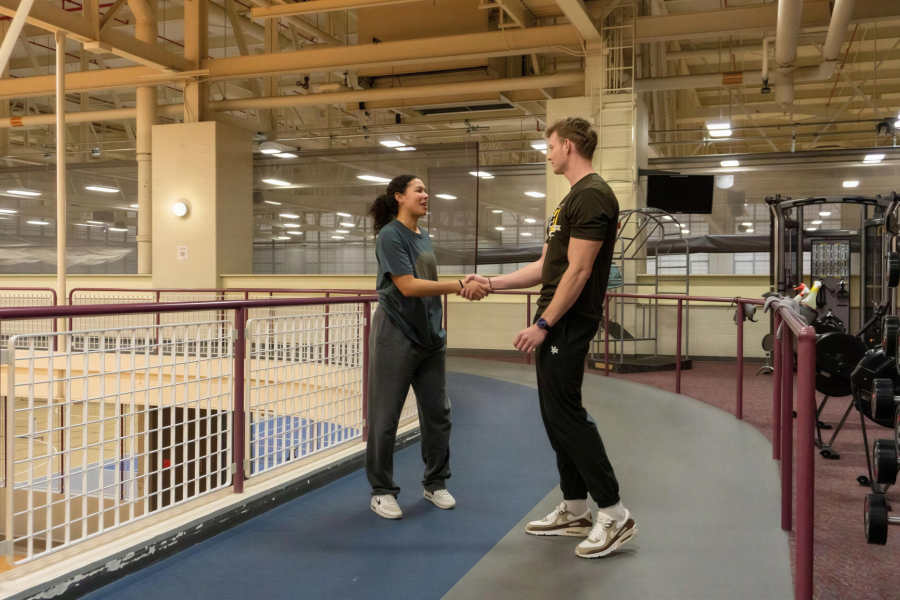 WMU SRC Personal Trainer guiding a client through a workout