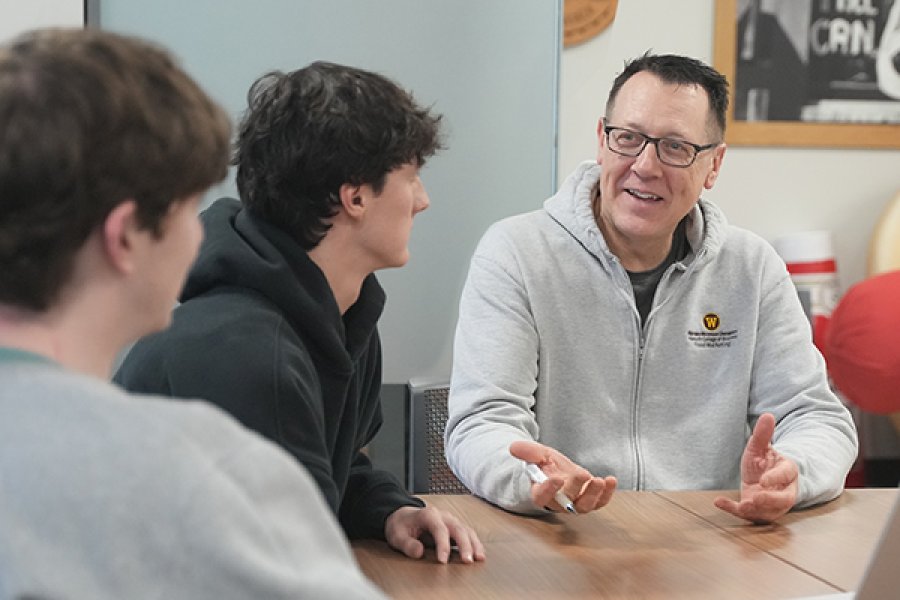 Professor with his two students