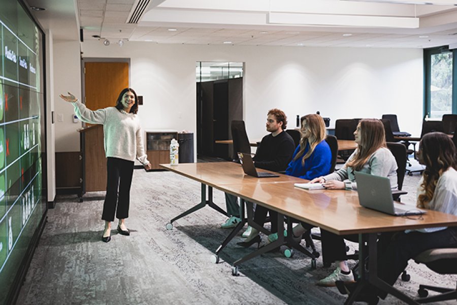 Students and a speaker in a conference room
