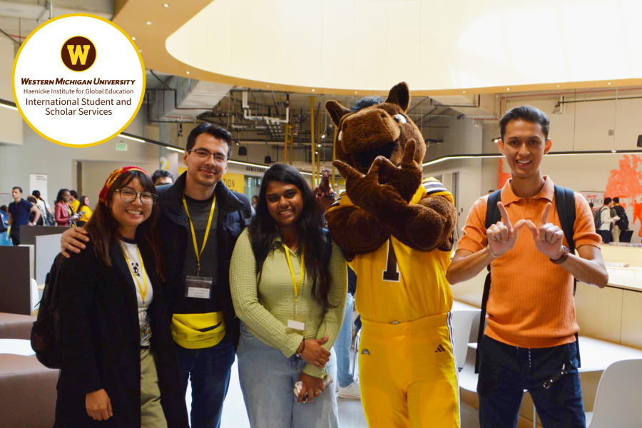 Decorative: Logo for International Student and Scholar Services at WMU. Photo of international student at orientation.