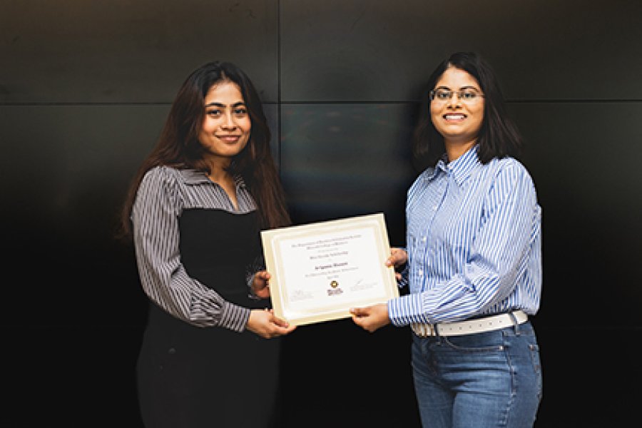 A student and a professor getting scholarship