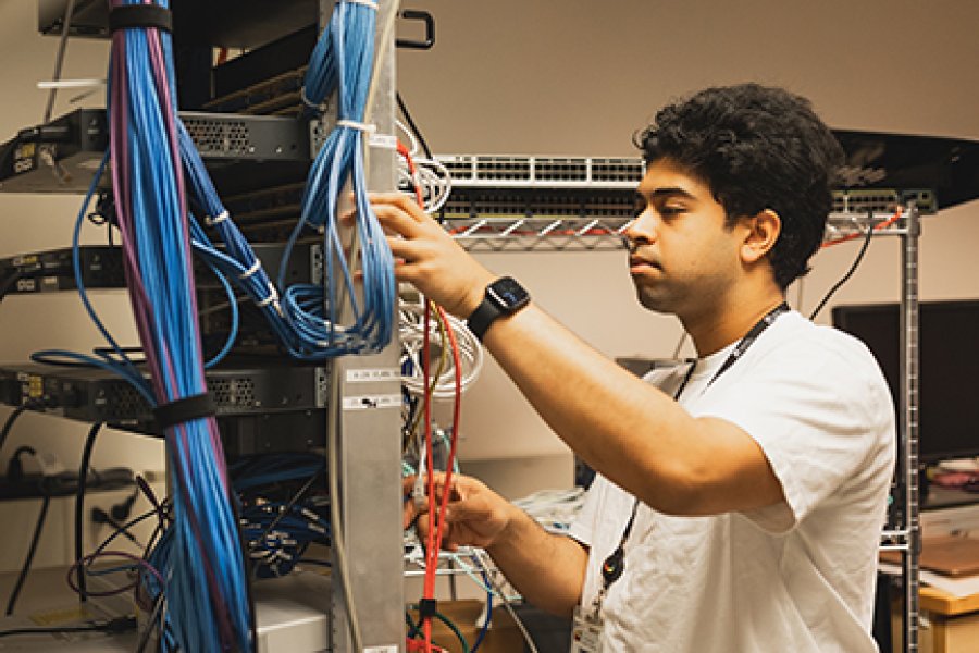 A student working on cables