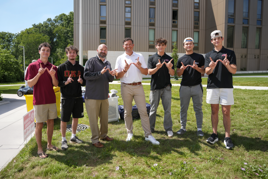 President Kavalhuna with students at move-in