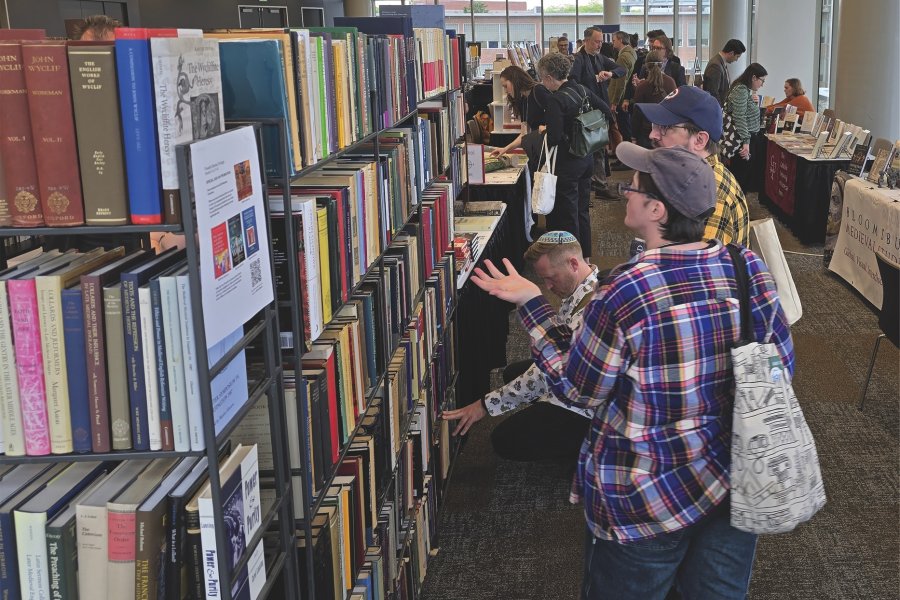 People viewing medieval history books
