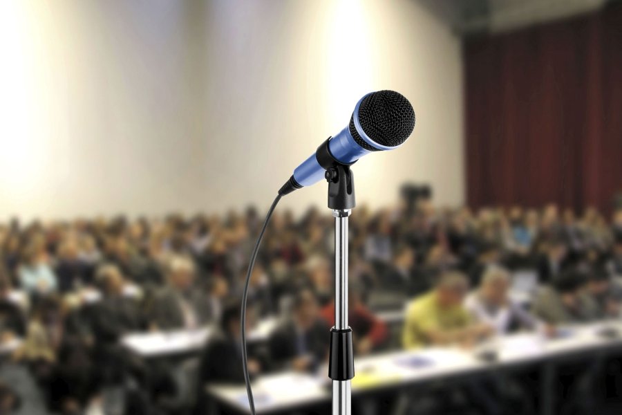 Photo of a microphone in a lecture hall.