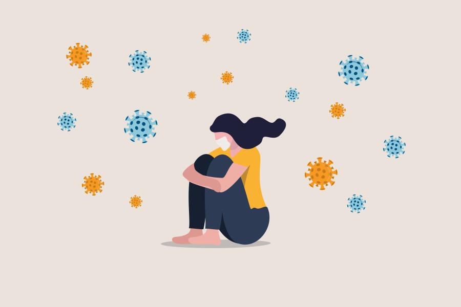 An illustration of a woman sitting with her arms around her knees, surrounded by coronavirus pathogens.