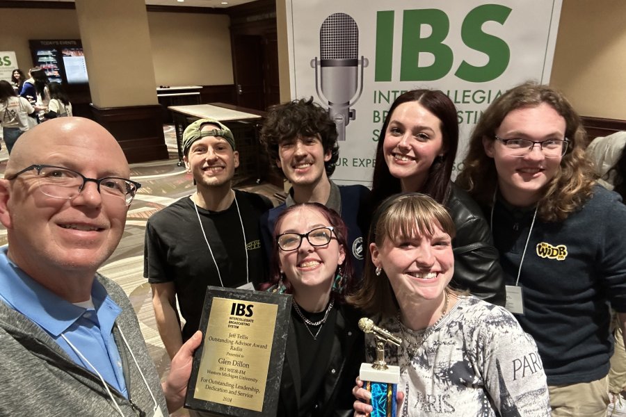The student media group pose with their awards at the IBS conference.