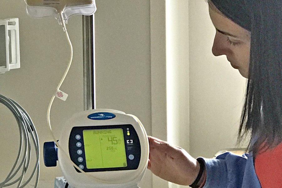 student monitoring medical equipment