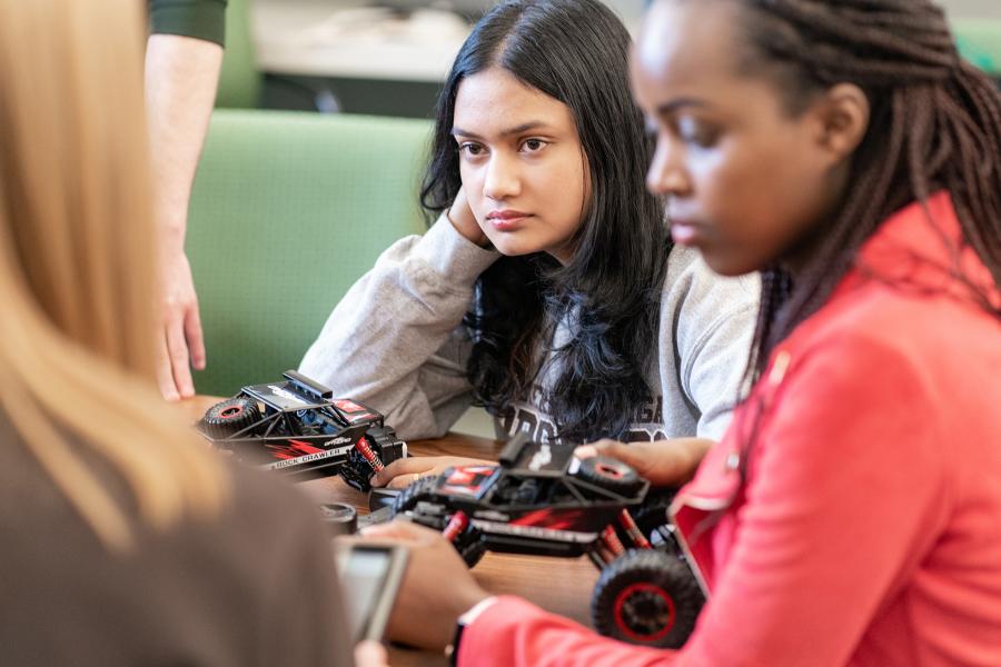 Mechanical engineering students working on a project. 