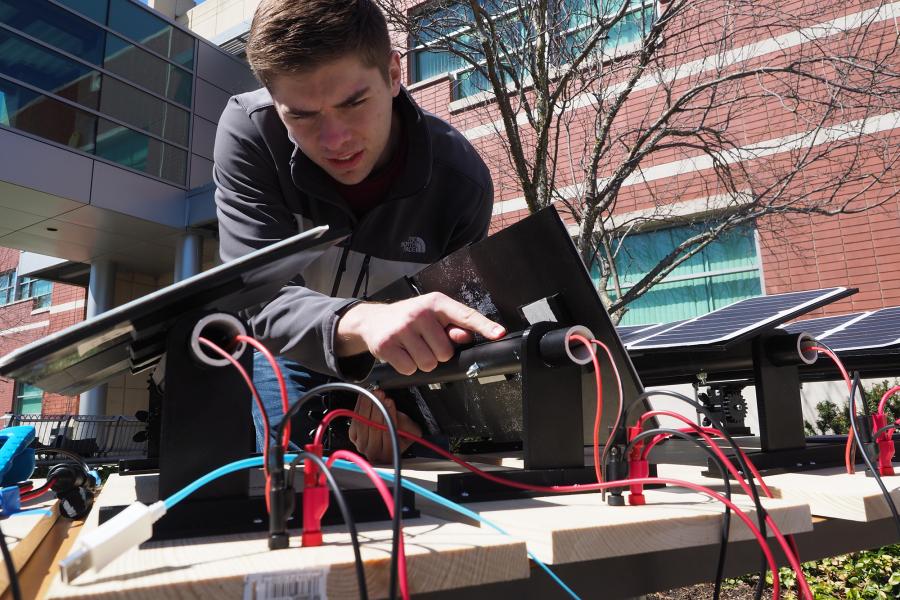 Engineering student working on solar panel project.