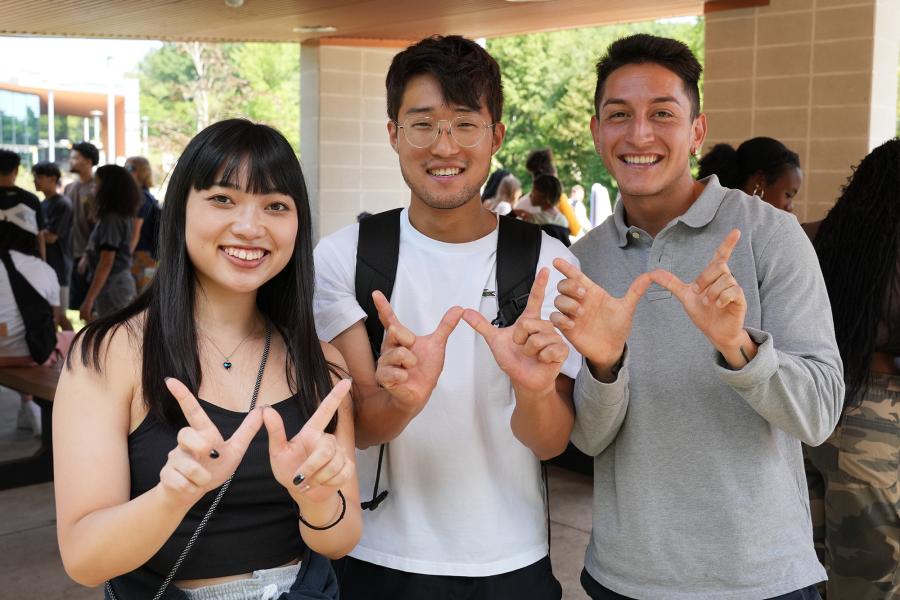 Three students during a multicultural event on campus.