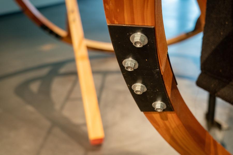 A large wooden sculpture in an art gallery.