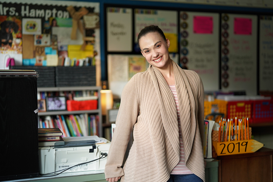 Teacher smiling in classroom