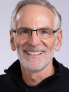 Professional portrait of Tim Palmer wearing a black sweater