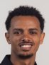 A zoomed in photo of Tadege's headshot, showing just his head.