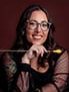 Headshot photo of woman, wearing glasses. 