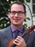 Headshot photo of man, wearing glasses. 