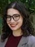 Headshot photo of woman, wearing glasses. 