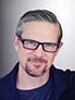 small headshot photo of Daniel Jonas