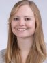 A professional headshot of Katie Holland
