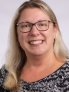A professional headshot of christina oberheim