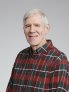 Jon Davis professional photo wearing plaid shirt