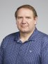 Brian Hadley profession headshot with blue shirt