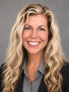 blonde female with black blazer and grey shirt