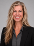 blonde female with black blazer and grey shirt