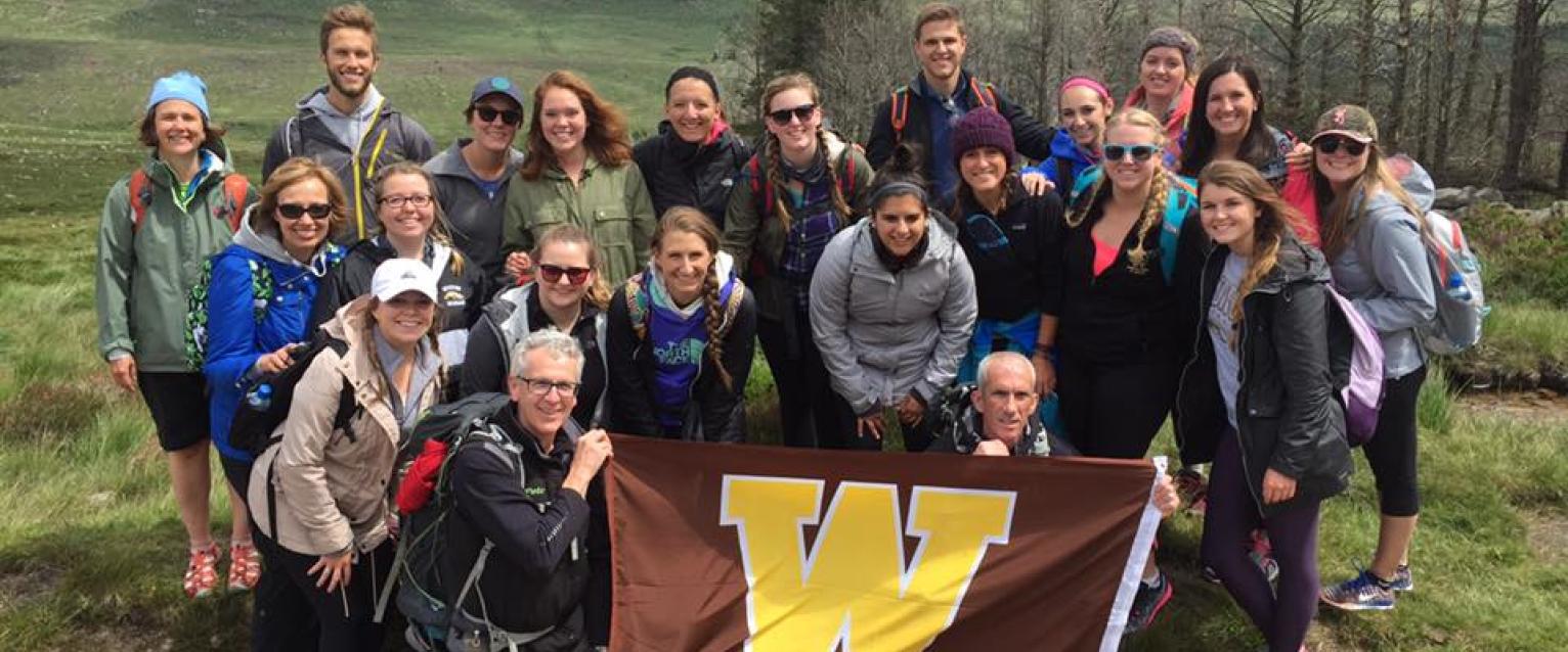 Group of students holding a Western Michigan University flag in Ireland