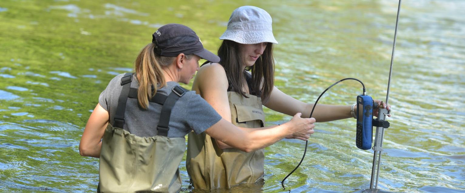 tiffany schriever helps student with river water measurements