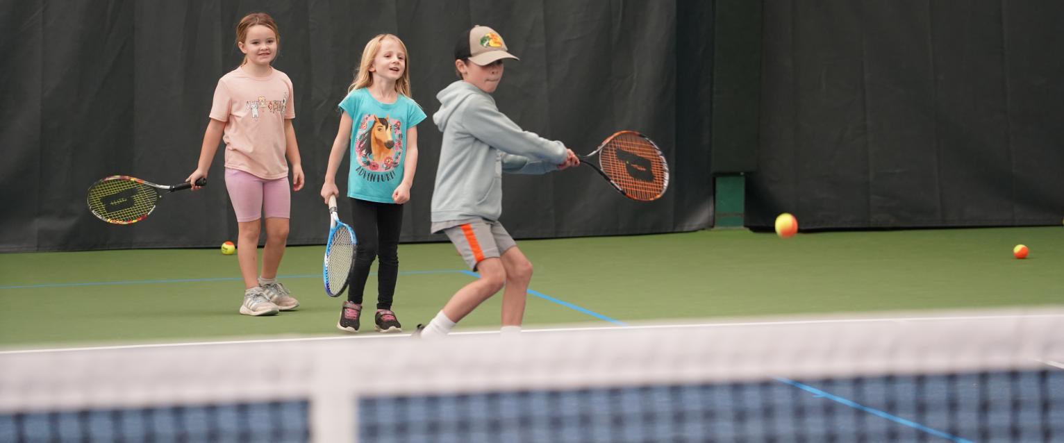 kids in a tennis class at West Hills