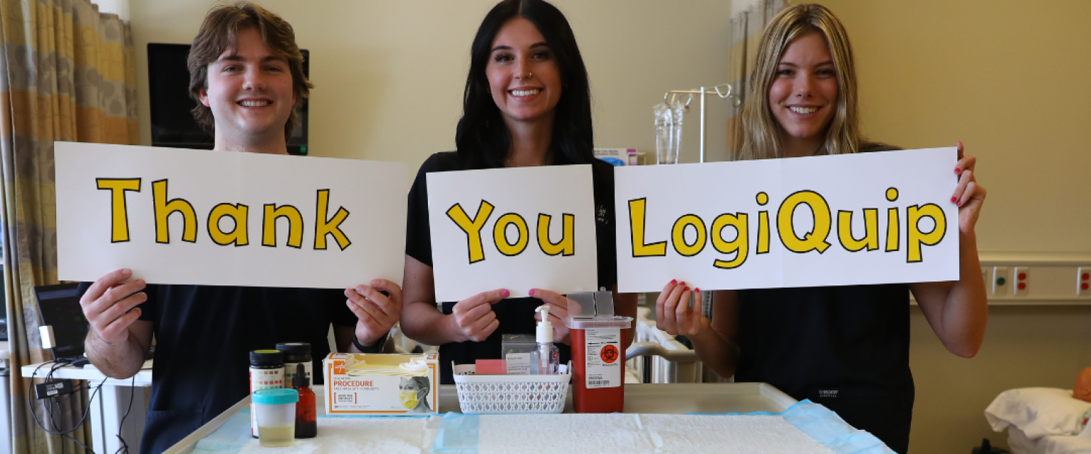 nursing students holding signs that read thank you logiquip