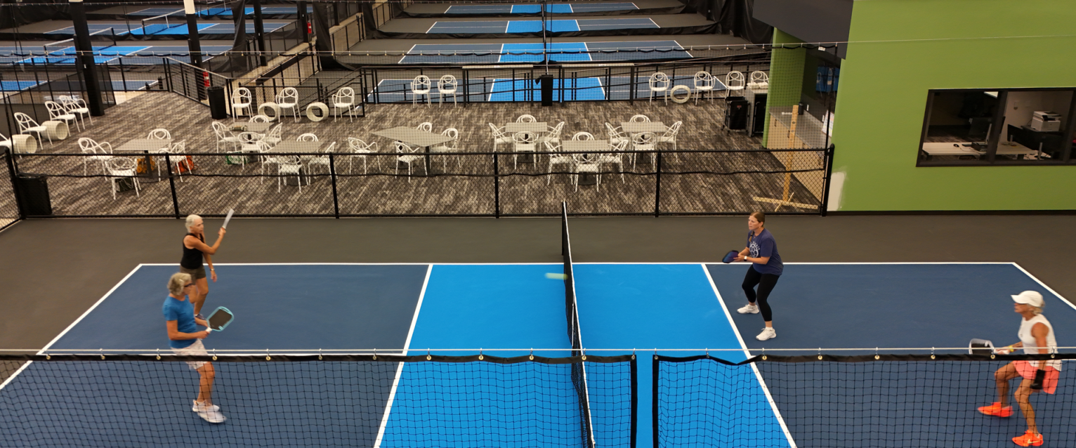 Arial of ladies playing pickleball at the Latitude 42 Pickleball Complex