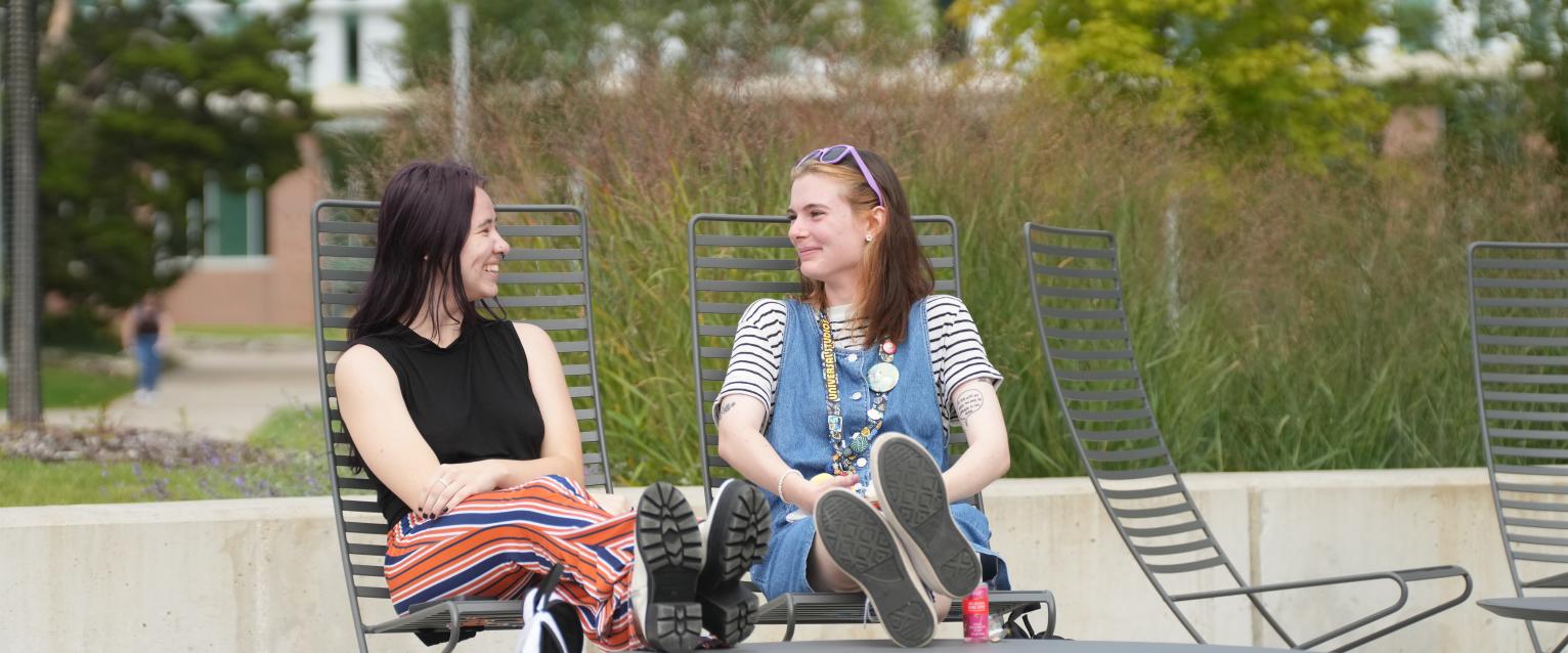 Students sit outside the Student Center