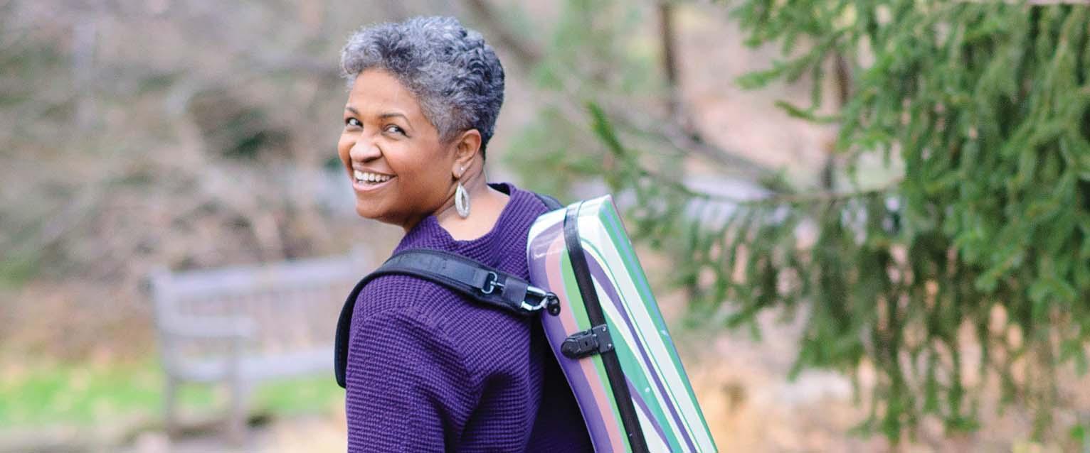 photo of viola player looking back over shoulder