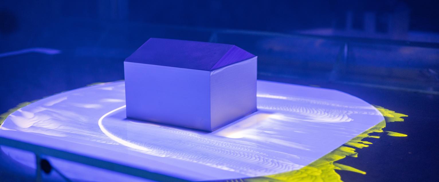 A house with colored lights around it. 