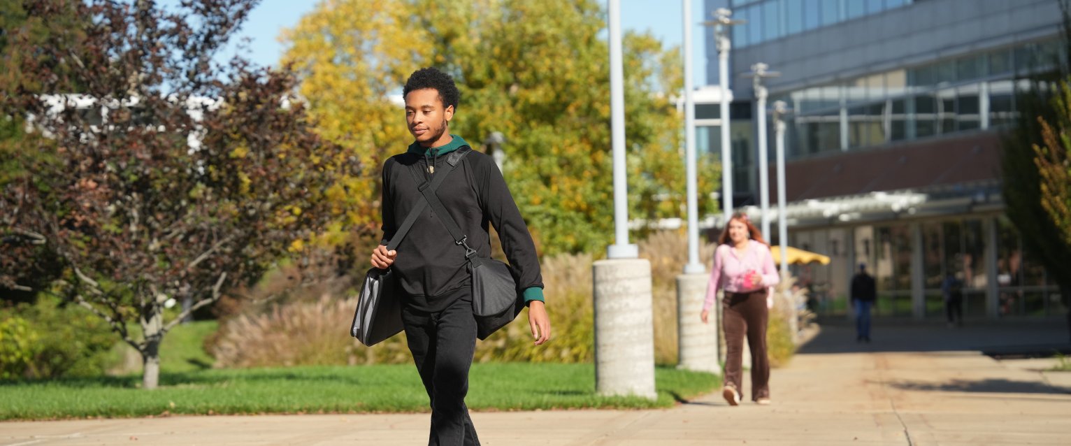 A student walks on Western Michigan University's campus.