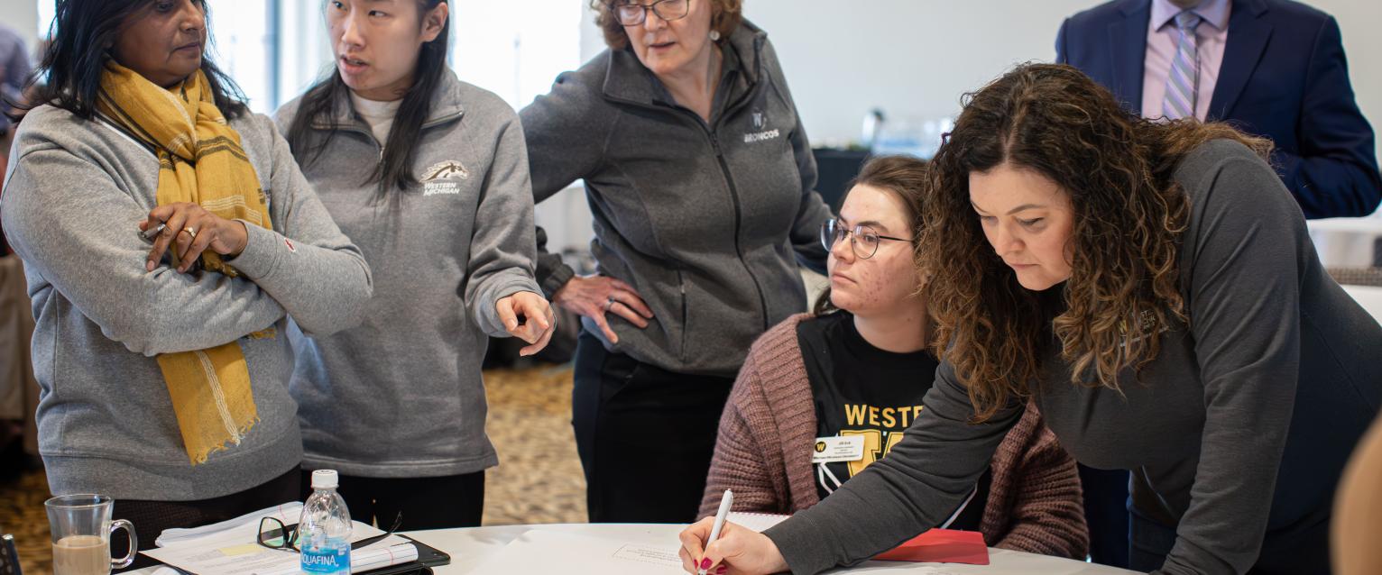 Multiple people collaborating in a conference room