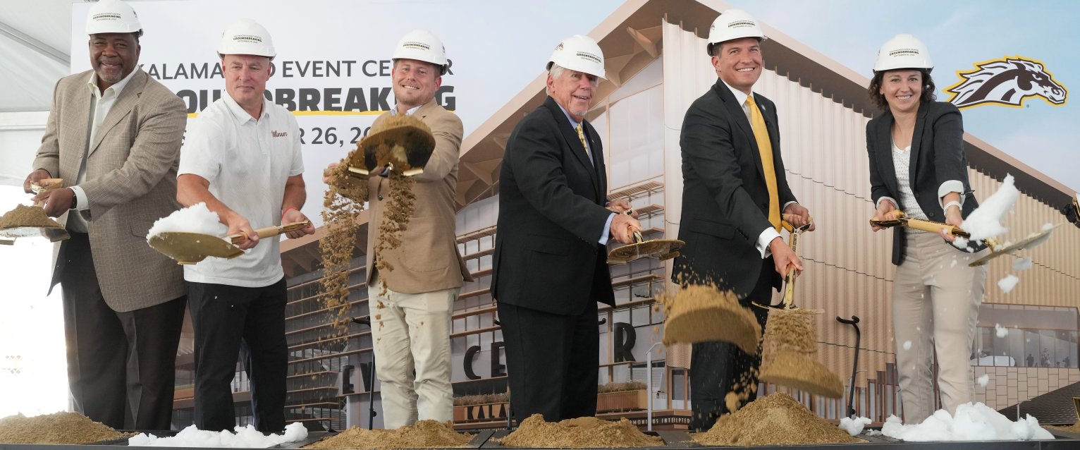 WMU coaches and leaders toss dirt at the event center groundbreaking.