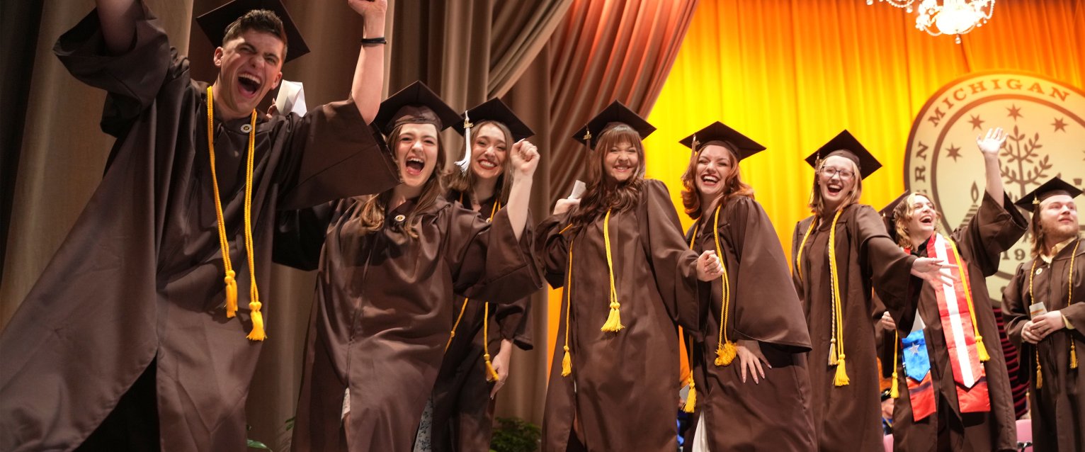 2025 graduates celebrate on stage