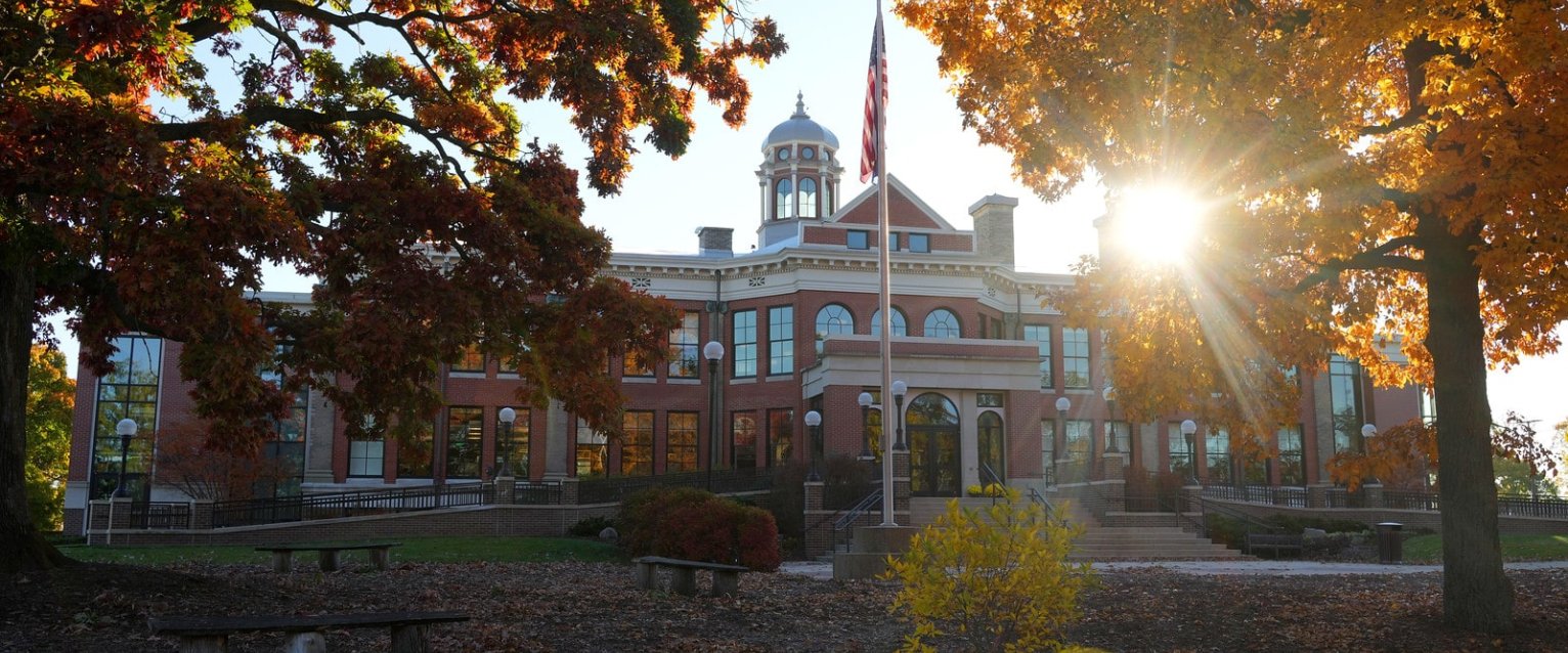 Heritage Hall on a fall day seen during a sunrise.