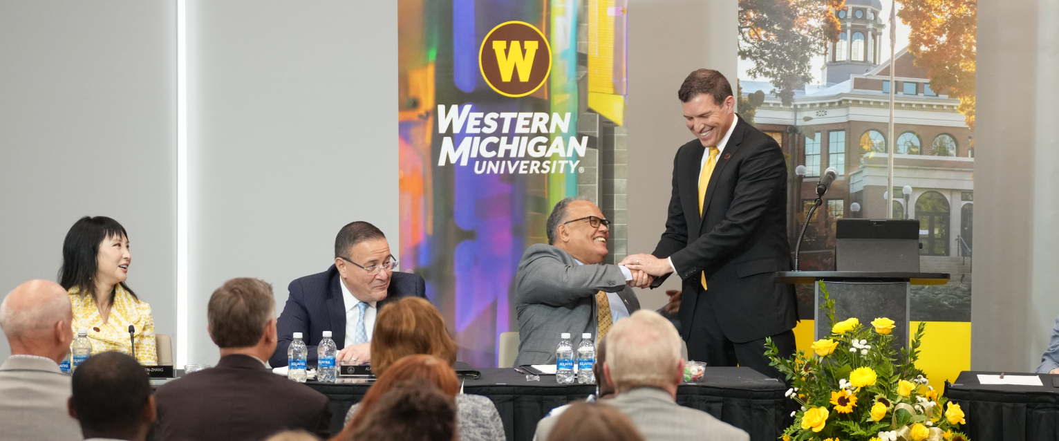 President Kavalhuna shakes hands with President Edward Montgomery