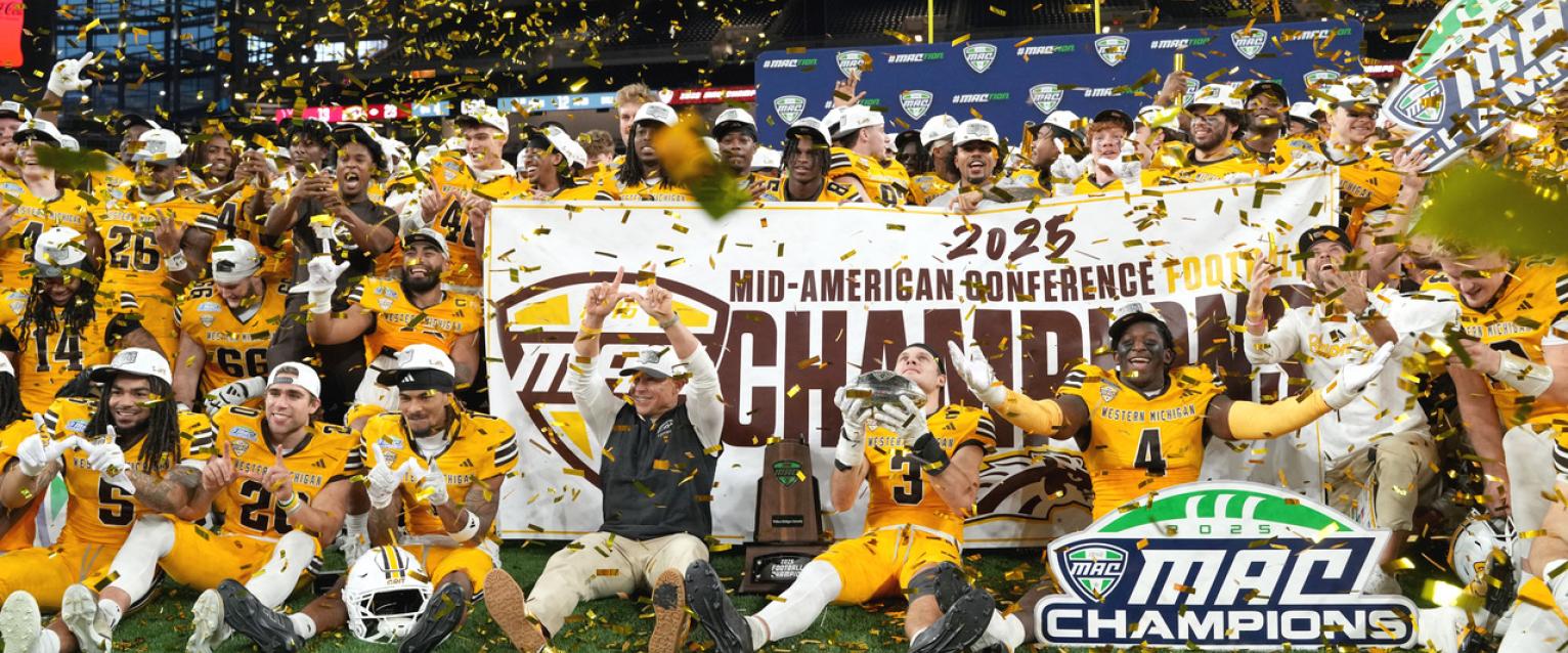 WMU football team celebrates their MAC Championship win on the turf at Ford Field