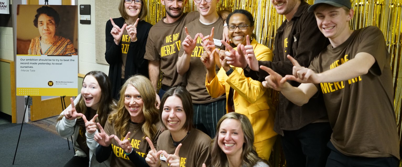 Office of Student Transitions Professional and Student Staff posing for a photo during Merze Tate Day 2025 Celebrations.